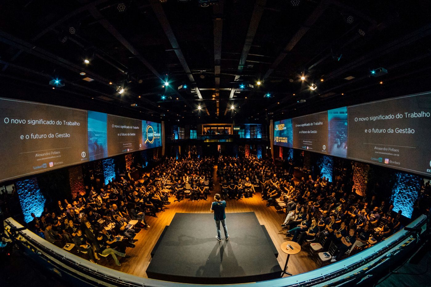 The audience pictured from behind a speaker
