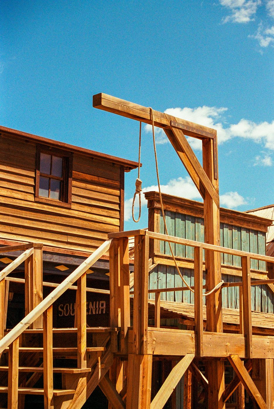 A wooden gallows in an old west town